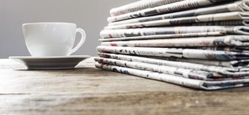 Newspapers with a cup of coffee